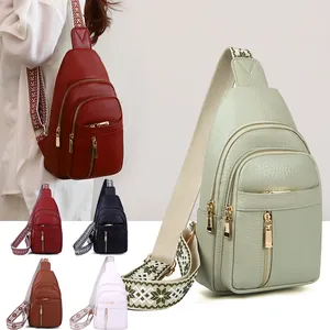 Vintage pebbled leather sling bags for women with colorful embroidered wide straps.