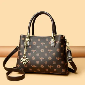 Elegant dark brown handbag with kangaroo floral print and gold metal hardware
