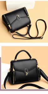 Detailed view of a black pebbled leather handbag featuring elegant gold hardware accents