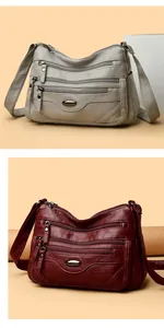 Large capacity multi-zipper women's shoulder bags in off-white and burgundy colors.