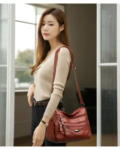 Lifestyle shot of a high-quality brown faux leather large capacity crossbody bag for women