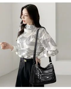 Large capacity black multi-pocket crossbody bag for women shown on a fashion model