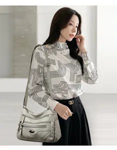 Large capacity grey crossbody bag for women with multi-zipper detail on model