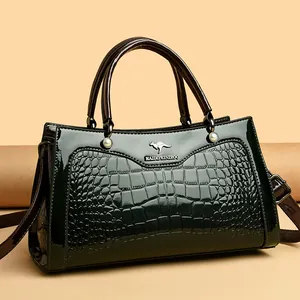 Elegant vintage dark green crocodile embossed leather handbag with kangaroo logo ornament