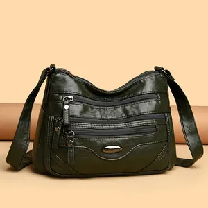 Large capacity dark green multi-zipper crossbody shoulder bag for women casual travel.