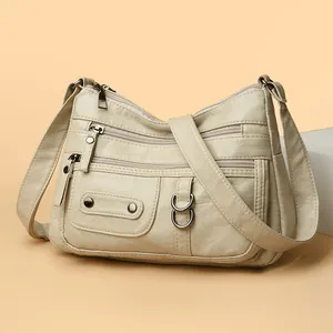 Off-white soft leather multi-pocket crossbody shoulder bag for women with large capacity.