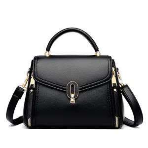 Classic black textured leather handbag for women with elegant gold hardware accents