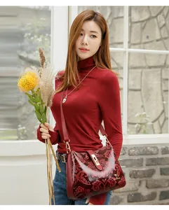 Elegant red embossed leather crossbody bag with retro floral patterns for women