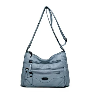 Fashionable women's multi-zipper crossbody bag in light blue soft PU leather