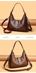 Detailed view of two elegant embossed cowhide underarm bags in brown and tan tones.