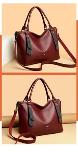 Elegante bolso de mano de cuero burdeos con logo de canguro dorado y correa ajustable