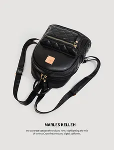 Detailansicht eines stylischen schwarzen Rucksacks aus PU-Leder mit Rautensteppmuster.
