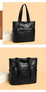 Bolso tote grande de cuero negro suave con logotipo de canguro y bolsillos extra