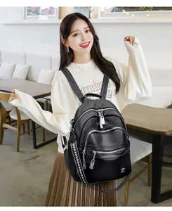 Casual black soft leather backpack for women with multiple zippered compartments and large capacity