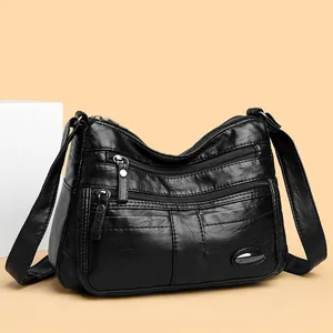 Classic black multi-pocket crossbody bag for women featuring soft faux leather texture