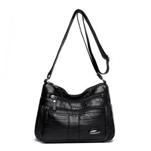 Stylish black soft leather crossbody bag for women featuring a multi-pocket design