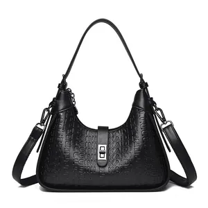 Elegant black embossed underarm bag with shoulder strap and silver turn-lock closure.