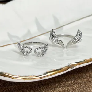 Exquisite silver-plated angel wing and reindeer antler rings with shiny pavé cubic zirconia.