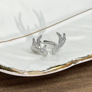 Close-up of silver reindeer antler ring pavé-set with sparkling white stones