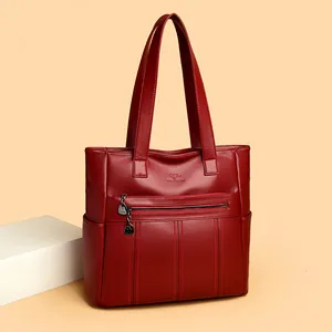 Bolso tote grande de cuero suave rojo para mujer con logotipo de canguro en relieve