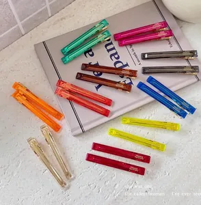 Vibrant transparent hair clips set featuring a variety of colors in a minimalist design