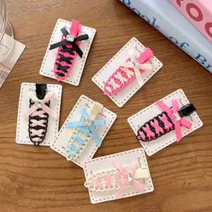 Set of 6 colorful corset-style lace-up hair clips with bow knots and crystals