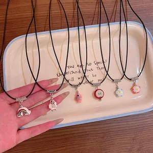 Colorful dopamine necklaces featuring rainbow flower and fruit pendants on black cords