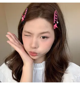 Asian model wearing pink balletcore ribbon woven hair clips with bow details