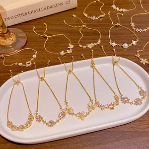 Elegant gold-plated cubic zirconia bracelets with cat's eye stone and adjustable pull chain