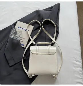 Stylish cream crinkled leather backpack for women, back view with sleek thin straps