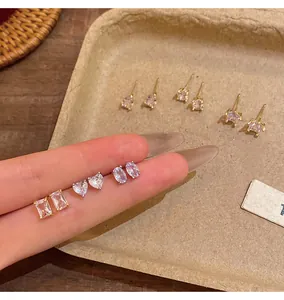 Close-up of multi-shape cubic zirconia stud earrings set including heart and rectangle.