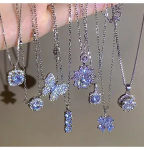 Detailed macro view of shiny zircon titanium steel necklaces with various pendants