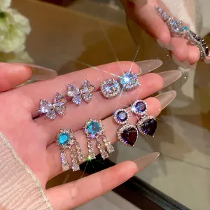 Elegant Korean style zircon earrings set with butterfly and heart fringe designs.