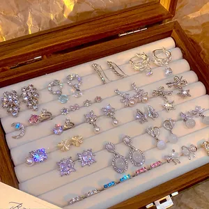Premium collection of Korean style zircon earrings and studs in a wooden jewelry display box