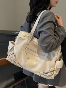 Large capacity beige women's tote bag featuring stylish buckle details and zippers