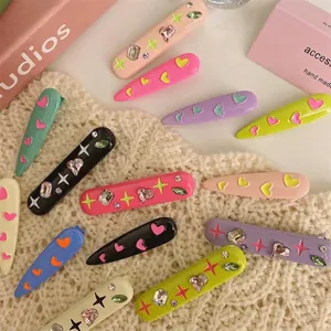 Close-up of vibrant Y2K style metal hair clips featuring colorful rhinestones and hearts