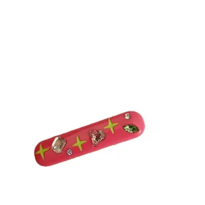 Pink Y2K dopamine style hair clip with colorful rhinestones and green stars