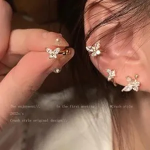 Close-up detail of a sparkling crystal butterfly ear bone clip for non-pierced ears.