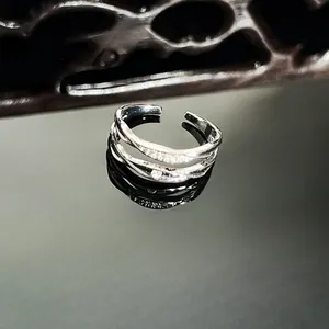 Detailed macro shot showing a silver double-layered ring with micro-pave cz stones