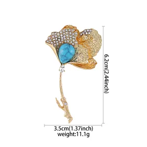 Technical detail view of gold ginkgo leaf brooch showing product size and weight