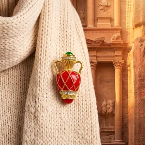 Vintage French style red enamel vase brooch with gold latticework and green gem