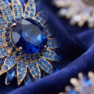 Elegant luxury crystal sunflower brooch featuring deep blue stones for banquet dress accessory