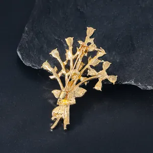 Detailed back view of the golden flower bouquet brooch showing the secure pin closure.