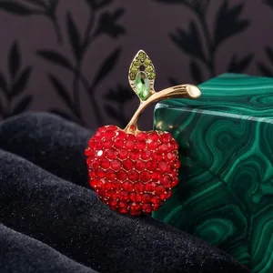 Sparkling crystal-studded red apple brooch pin with gold-tone leaf and malachite display