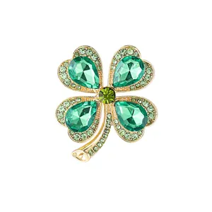 Classic gold-plated four-leaf clover brooch with sparkling green crystals and rhinestones