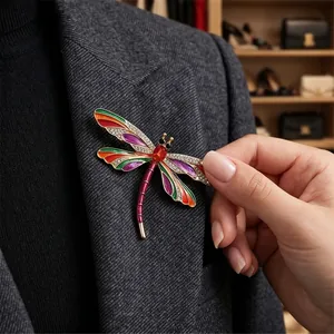 Elegant vintage dragonfly brooch with colorful crystals pinned on a blazer lapel
