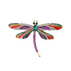 Vintage dragonfly brooch with colorful enamel and sparkling crystal accents for women