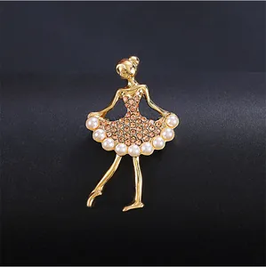 Detailed view of a golden ballet girl brooch with pearls and sparkling rhinestones