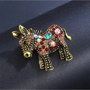 Close-up of vintage donkey brooch featuring colorful rhinestones and gold-tone metal detail
