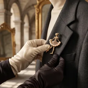 Elegant golden ballerina brooch with pearls and crystals pinned to a charcoal grey suit lapel